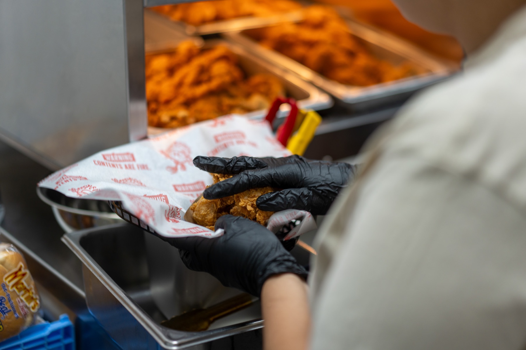 Birdcode team member preparing chicken by hand